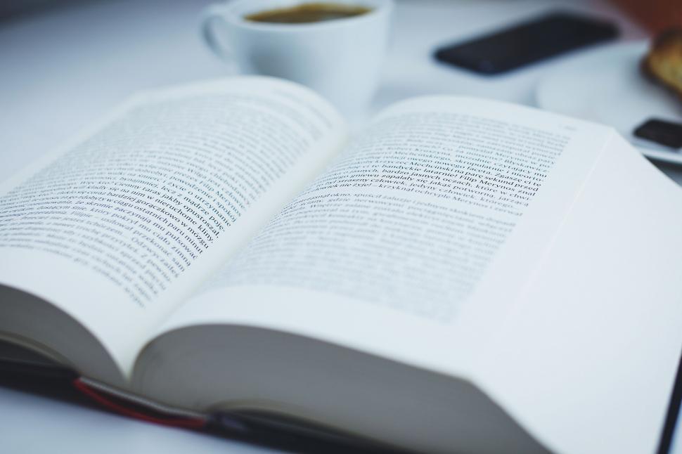 Free Image of Open book with coffee and smartphone on a desk 