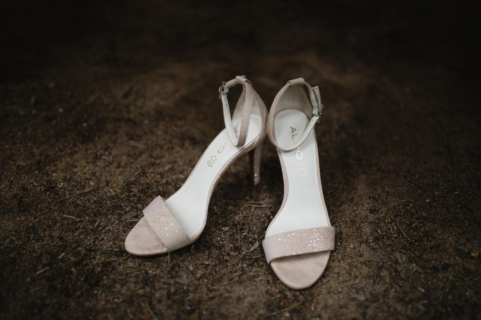 Free Image of Elegant bridal shoes on earthy background 