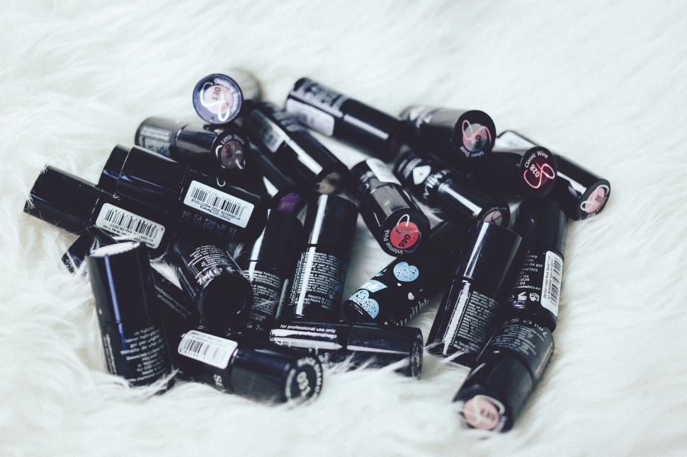 Free Image of Collection of Makeup Items on Fur 
