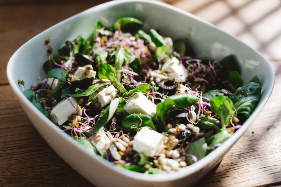 Free Image of Healthy nutritious salad bowl on wooden table 