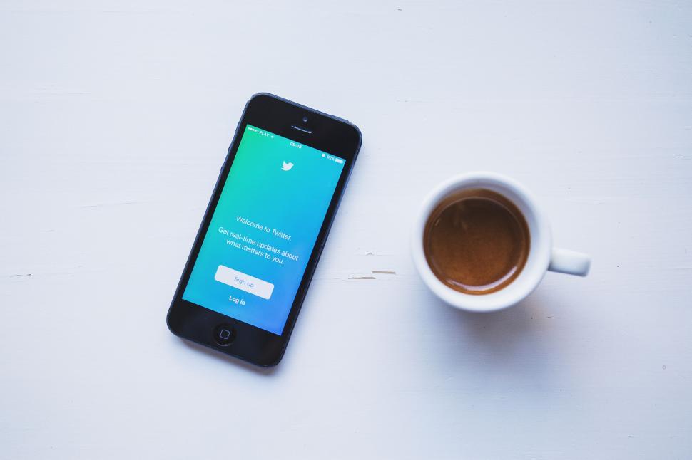 Free Image of Smartphone with Twitter app on coffee table 