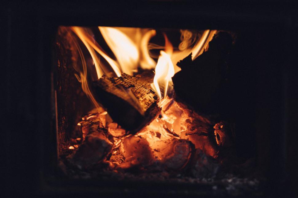 Free Image of Glowing firewood in a fireplace 