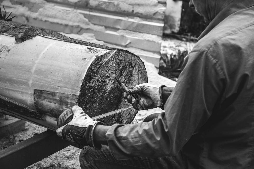 Free Image of Man carving wood with craftsmanship 