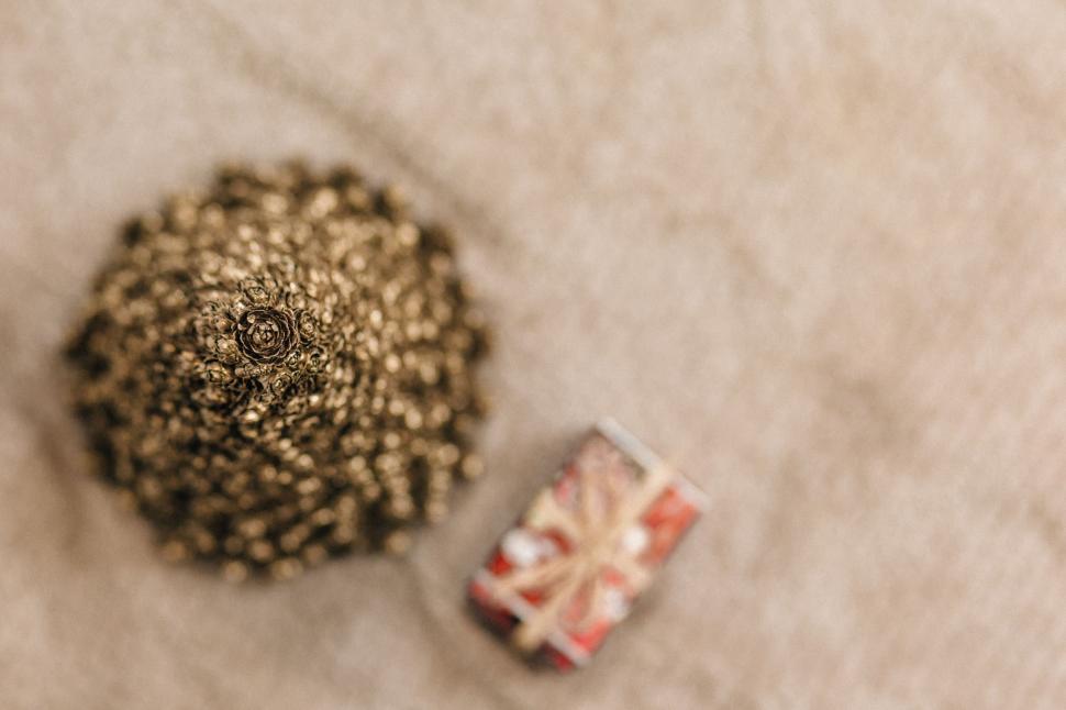 Free Image of Close-up of intricate golden brooch and ring 