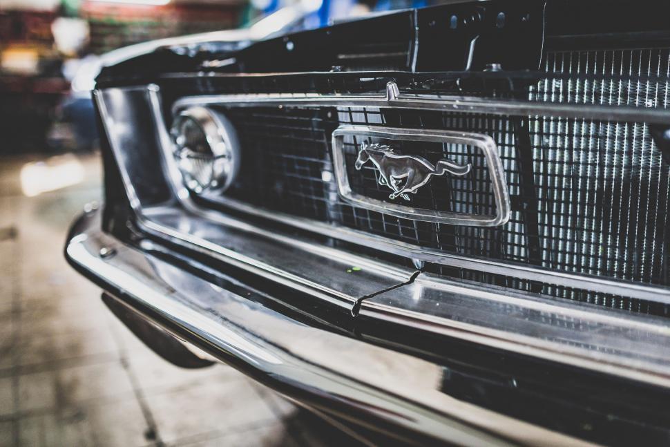 Free Image of Front grill detail of a vintage Mustang car 