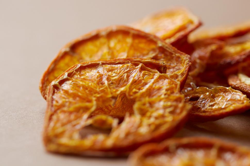 Free Image of Close-up of dried orange slices on table 