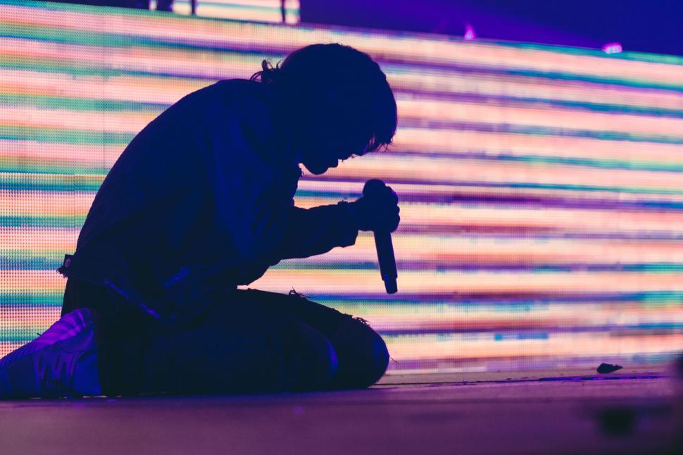 Free Image of Vibrant silhouette of a performer on stage 