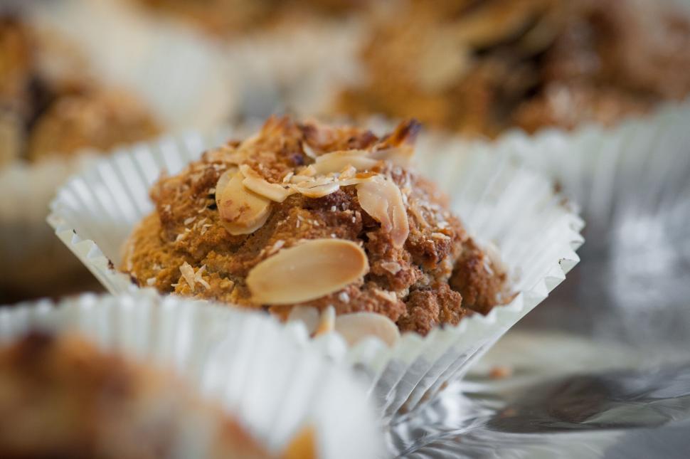 Free Image of Almond topped muffin in a paper cup 