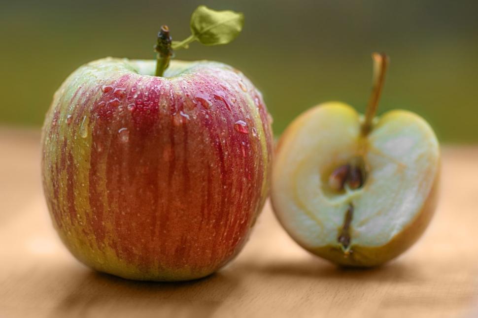 Free Image of Fresh Whole and Sliced Apple on Table 