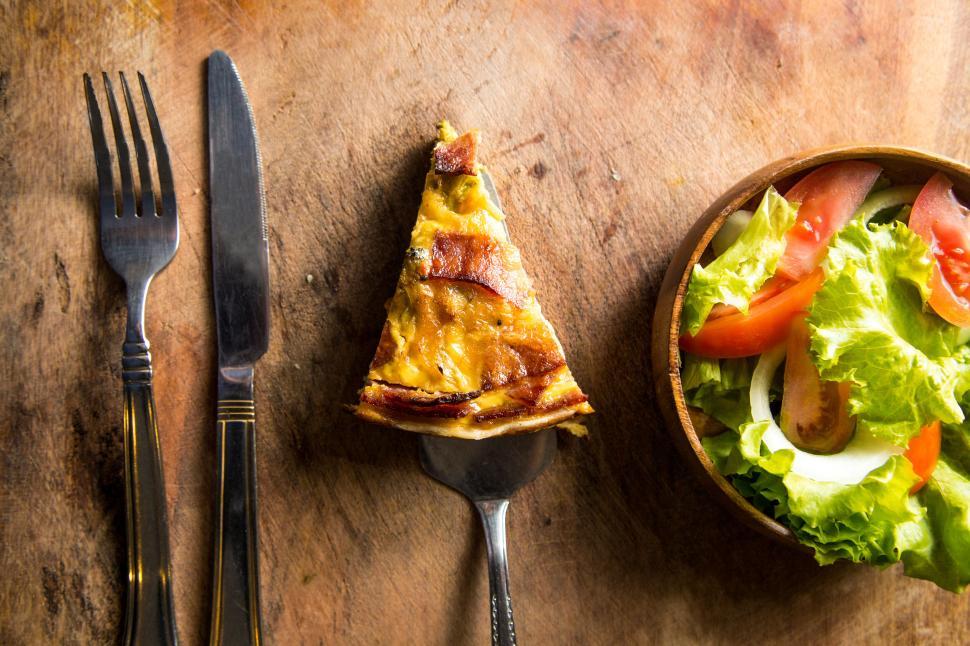 Free Image of Quiche lorraine with side salad on wooden table 