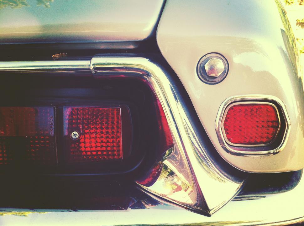 Free Image of Vintage car tail light and chrome detail 