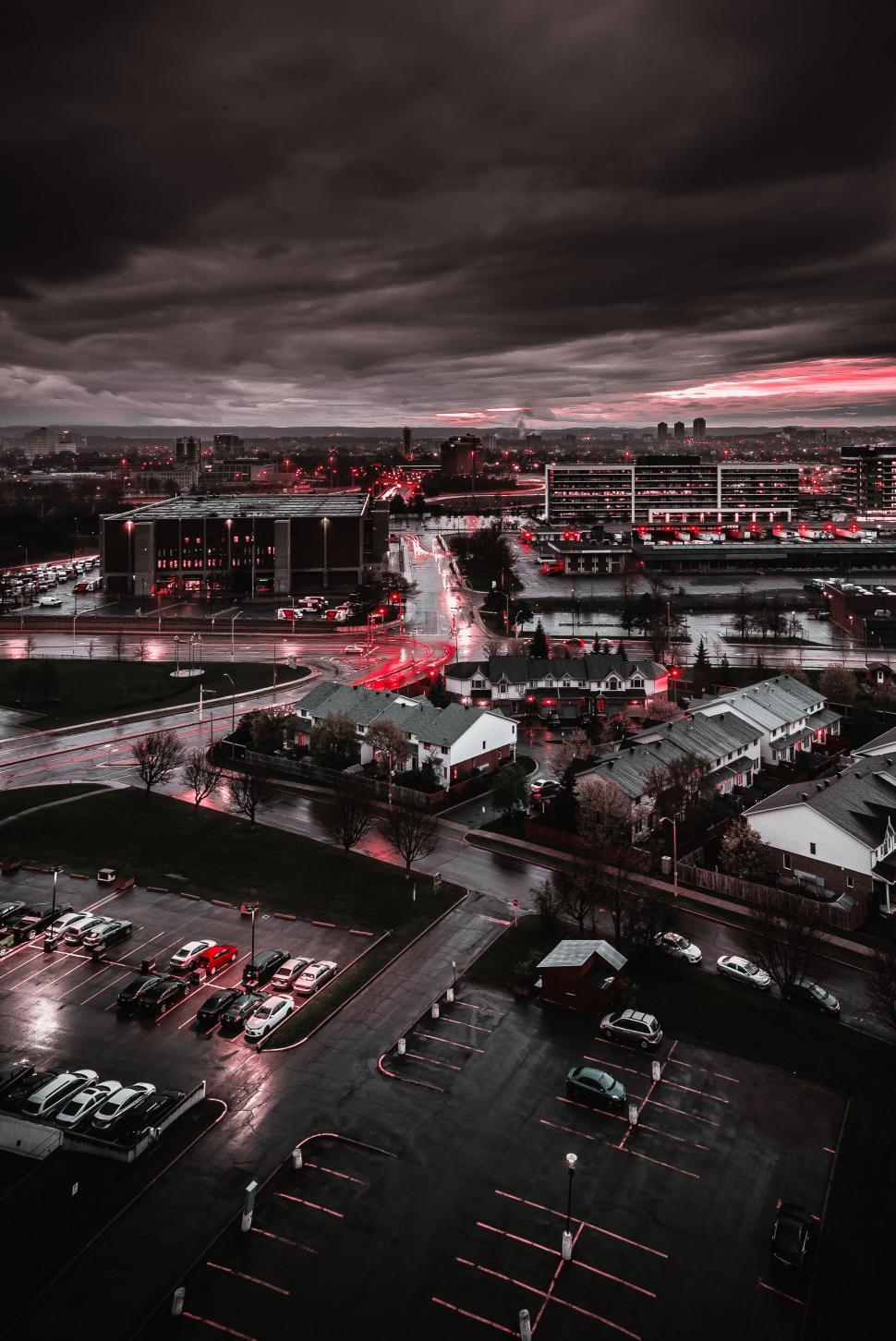 Free Image of Moody cityscape with vibrant red highlights 