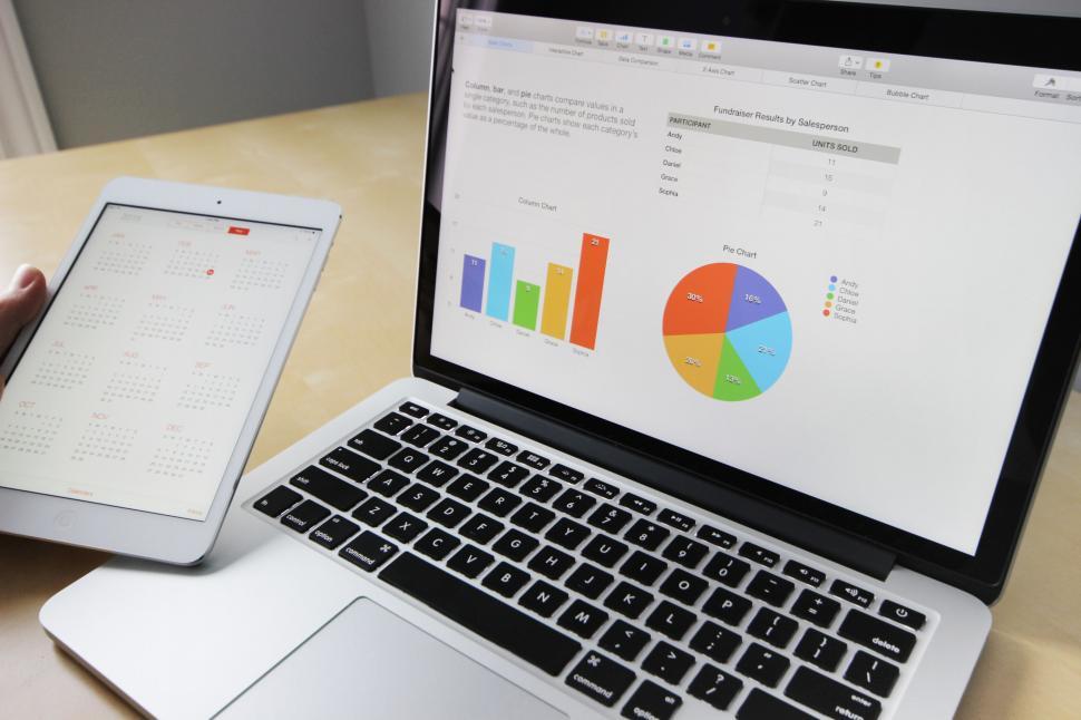 Free Image of Analyzing digital statistics on laptop and tablet 