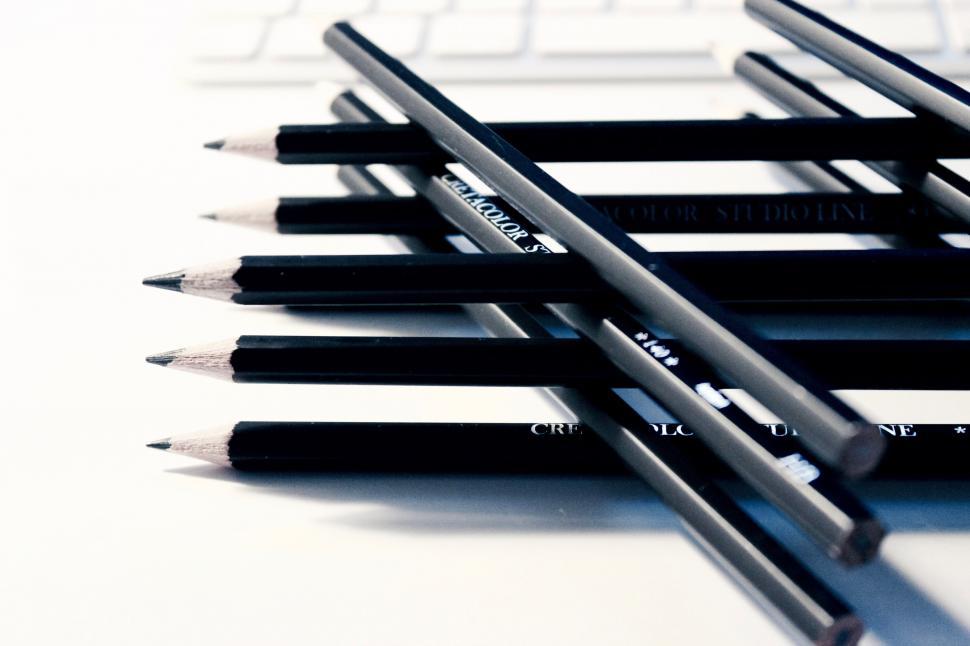 Free Image of Close-up of black graphite pencils arranged 