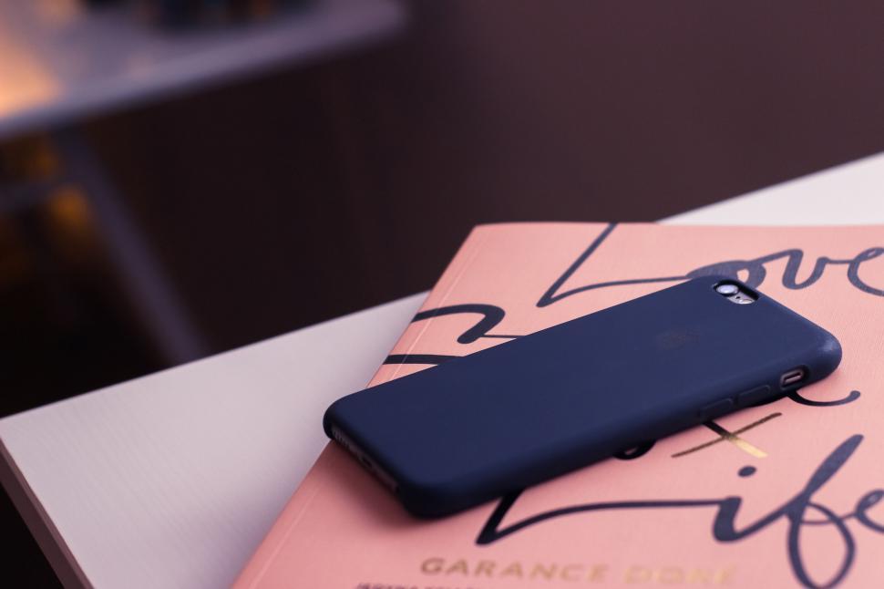 Free Image of Smartphone on a motivational book 