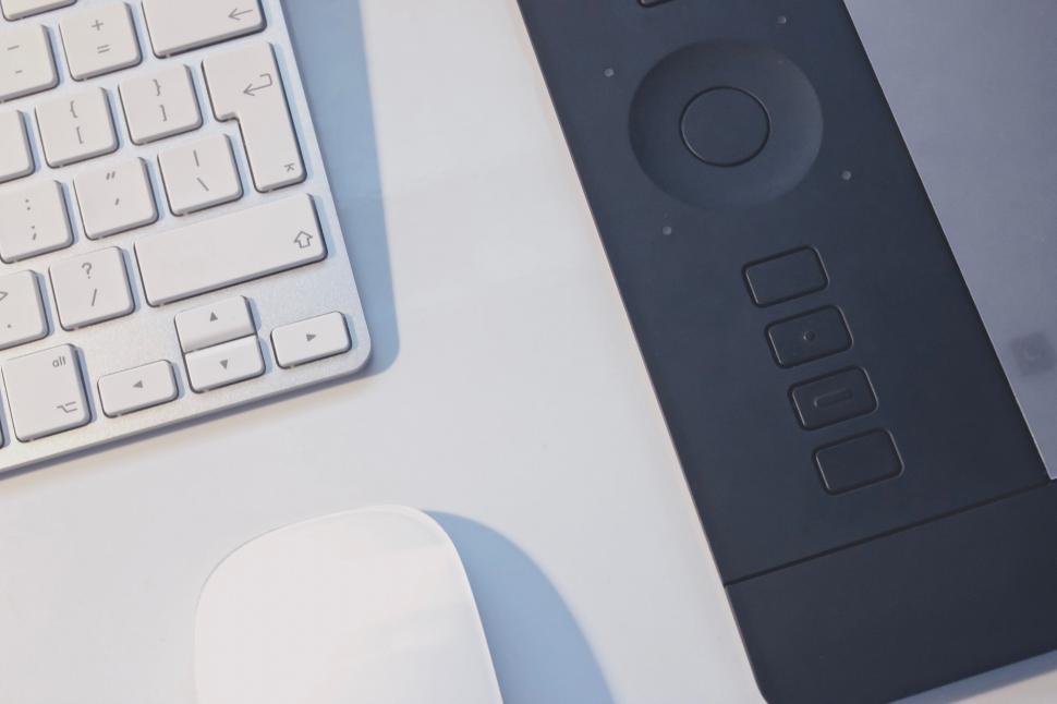 Free Image of Modern graphic tablet beside white keyboard 