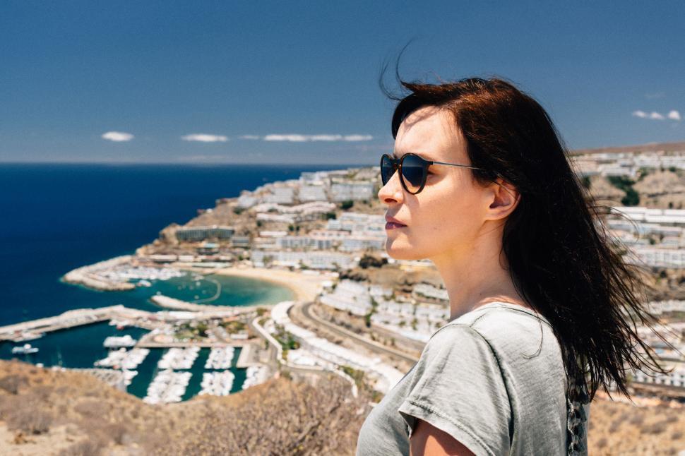 Free Image of Coastal town and marina from woman s POV 