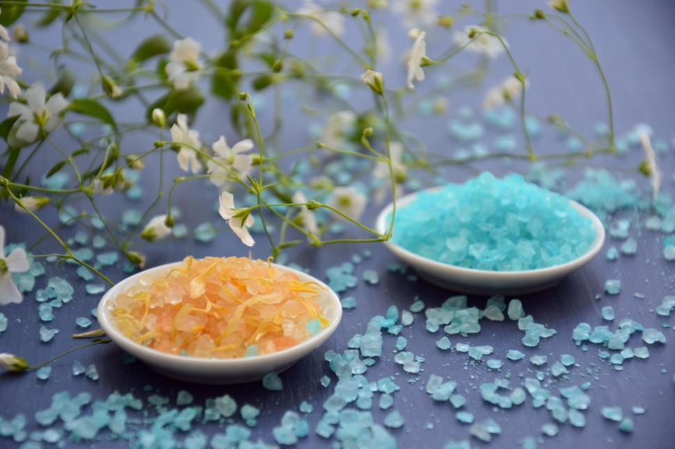 Free Image of Colorful bath salts on dark wooden background 