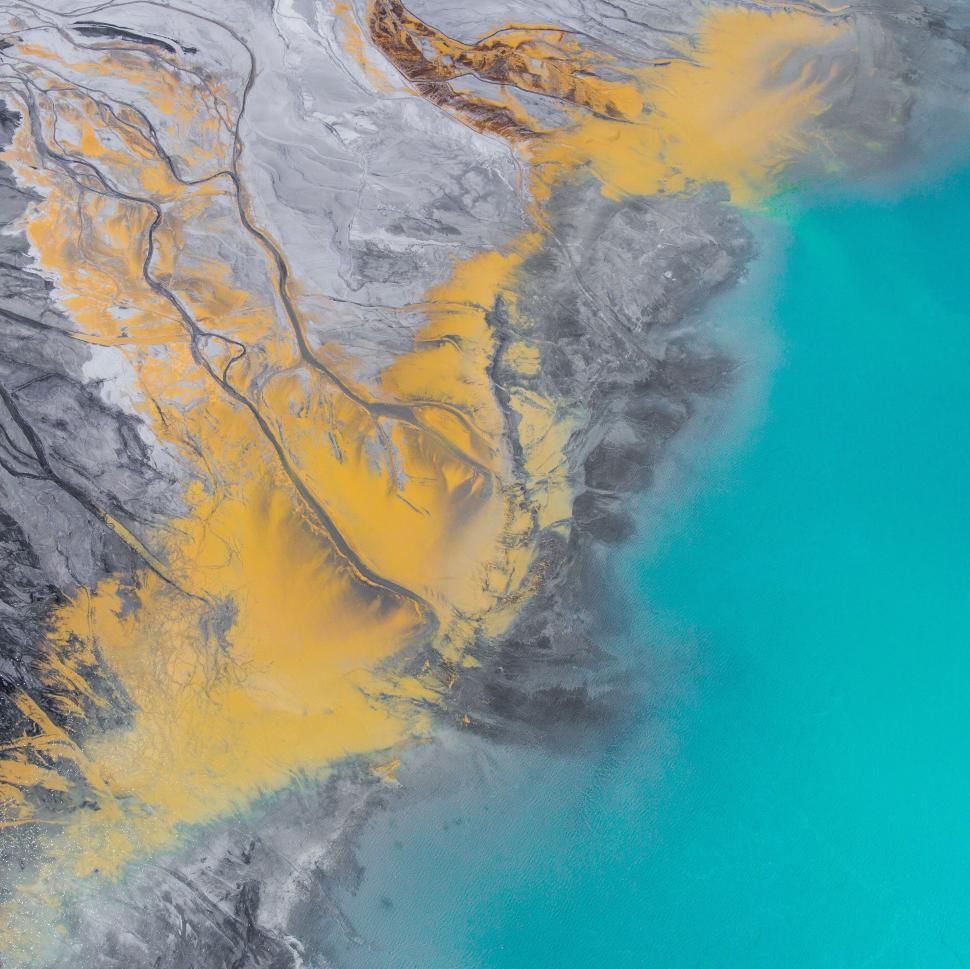 Free Image of Aerial view of colorful rivers and land 