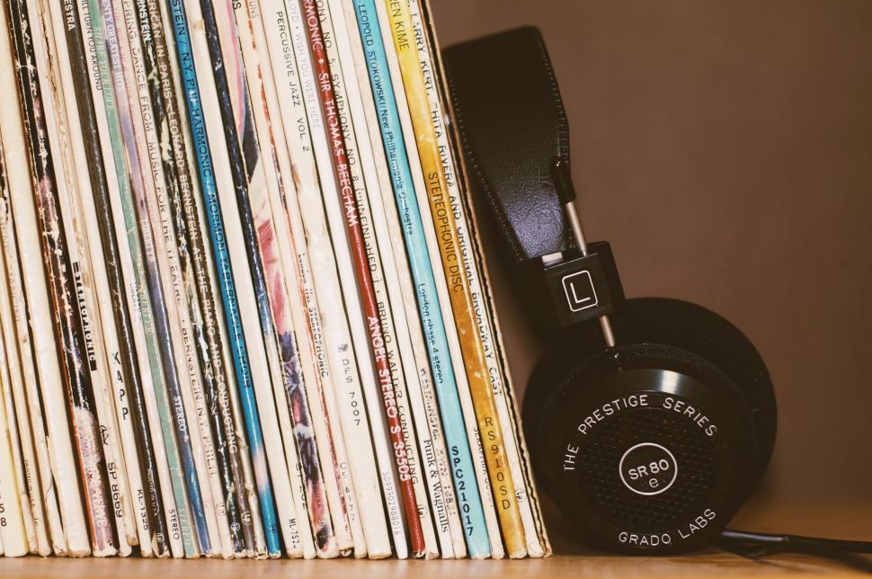 Free Image of Vinyl records and headphones on a shelf 