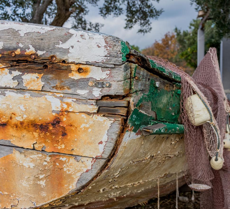 Free Image of Weathered boat with peeling paint and rust 