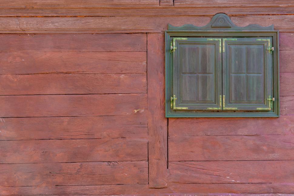 Free Image of Classic wooden window with decorative shutters 