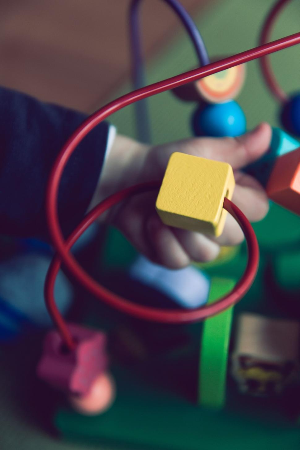 Free Image of Child s focus on educational toy 