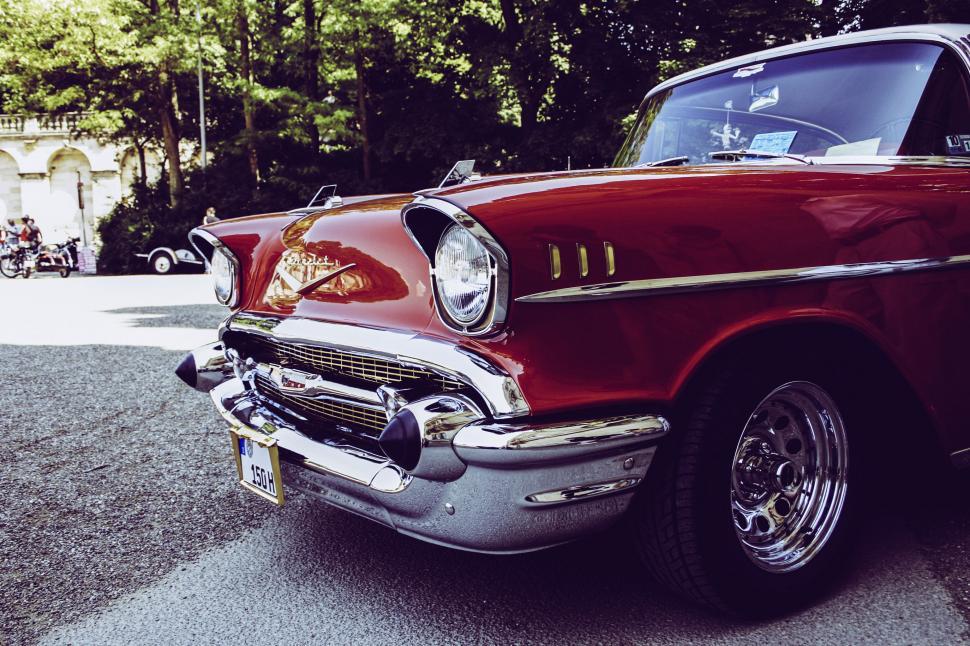 Free Image of Vintage red Chevy car parked outdoor 