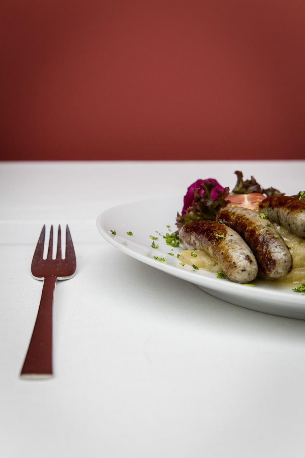 Free Image of Gourmet sausages served on white plate with salad 