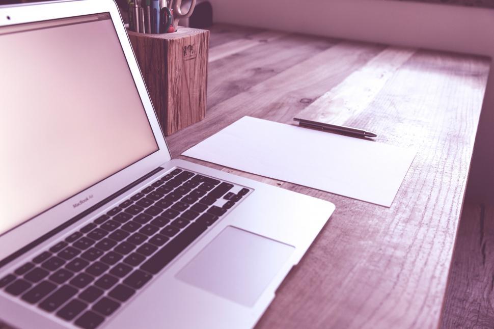 Free Image of Work desk with laptop and blank paper 