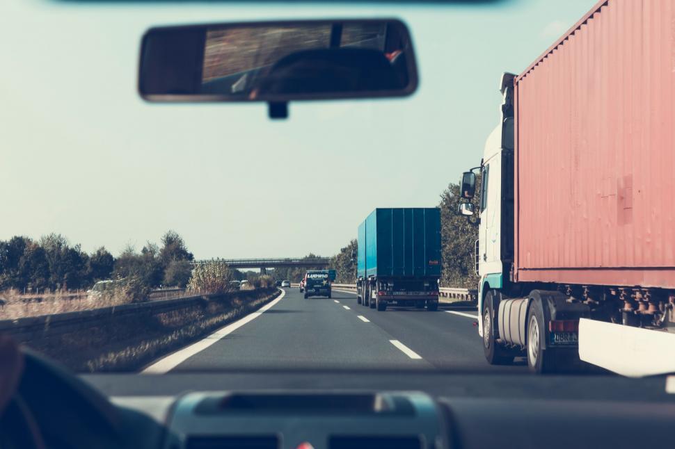 Free Image of Highway drive with trucks in the view 