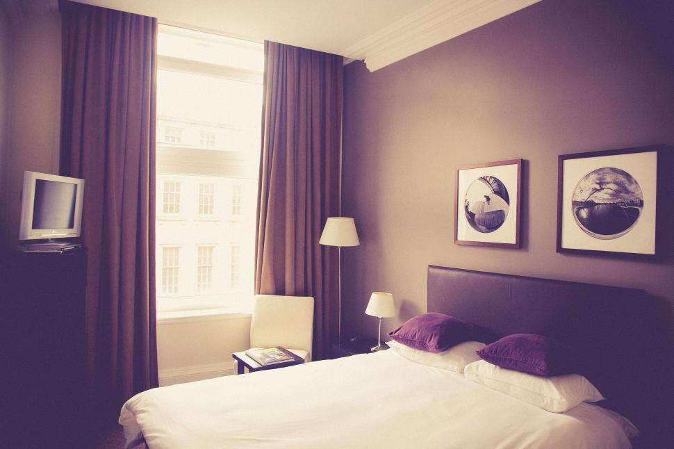 Free Image of Elegant bedroom interior with wall decor 