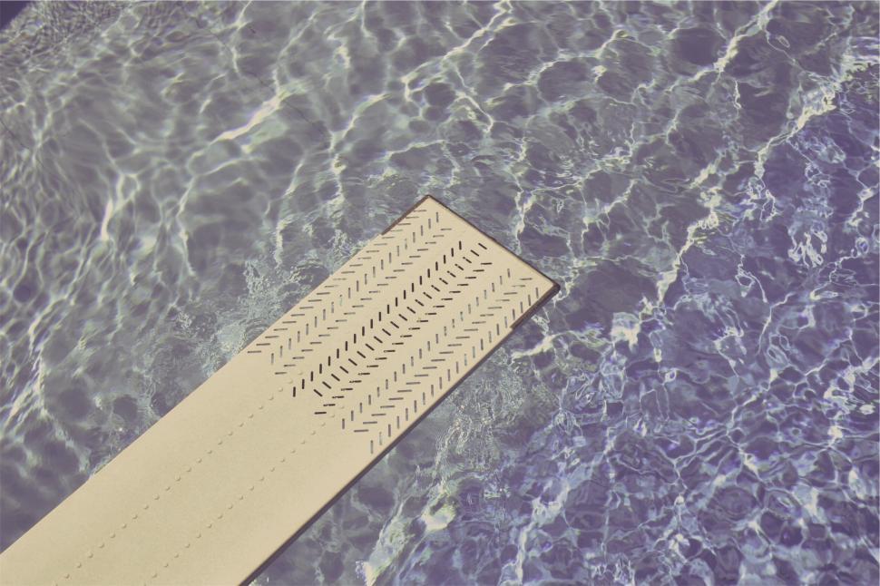 Free Image of Swimming pool with a diving board in sunlight 