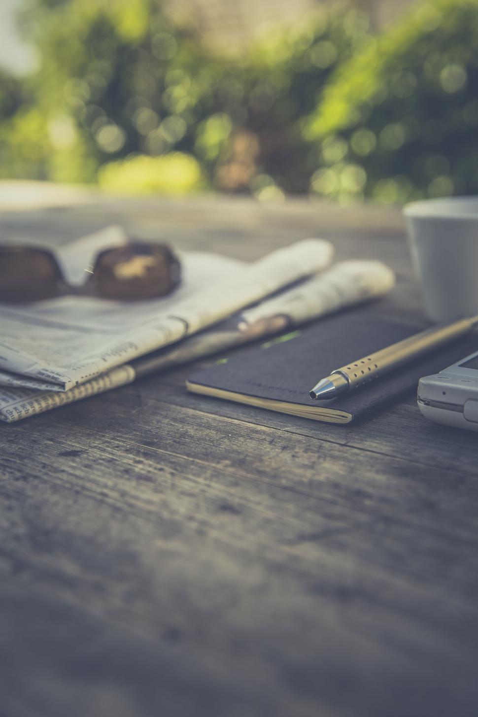 Free Image of Close-up of outdoor workspace with a smartphone 