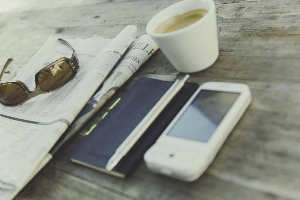 Free Image of Morning essentials with coffee and phone on wood 