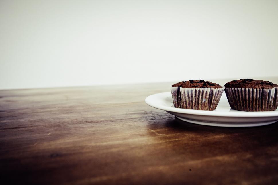 Free Image of Two chocolate cupcakes on a white plate 