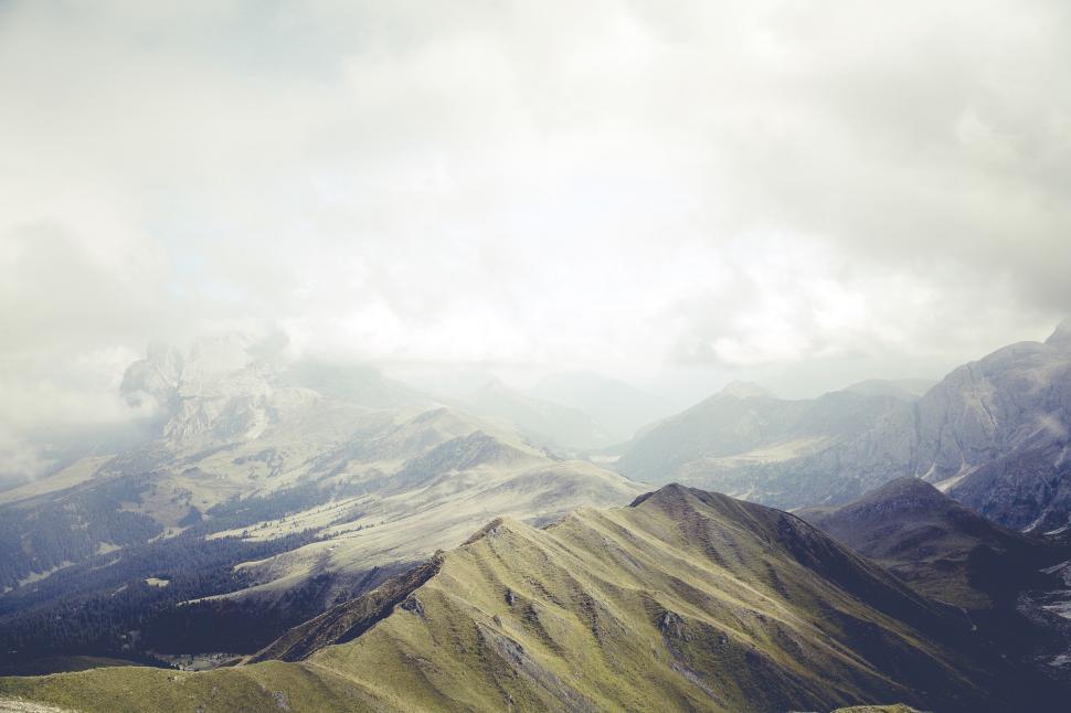 Free Image of Majestic mountain landscape under cloudy sky 