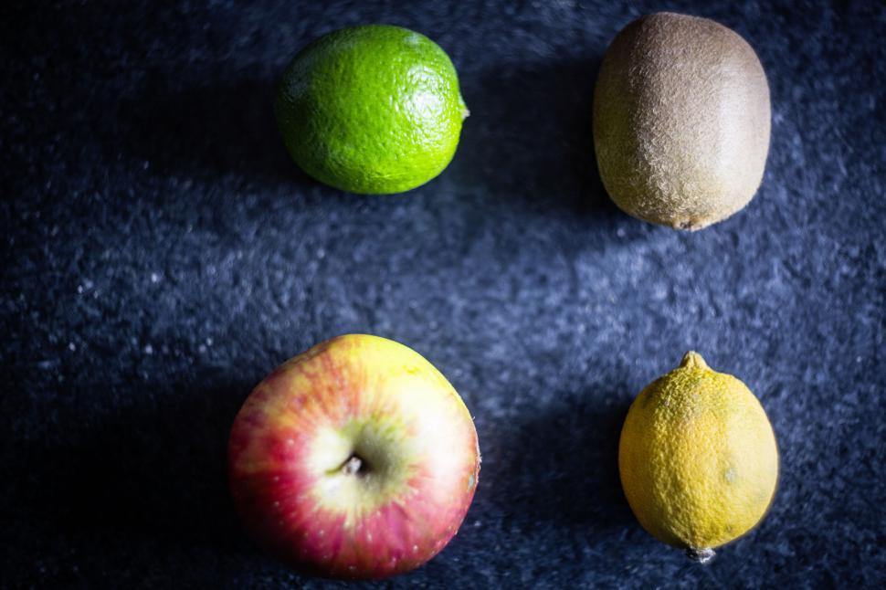 Free Image of Various whole fruits on dark background 