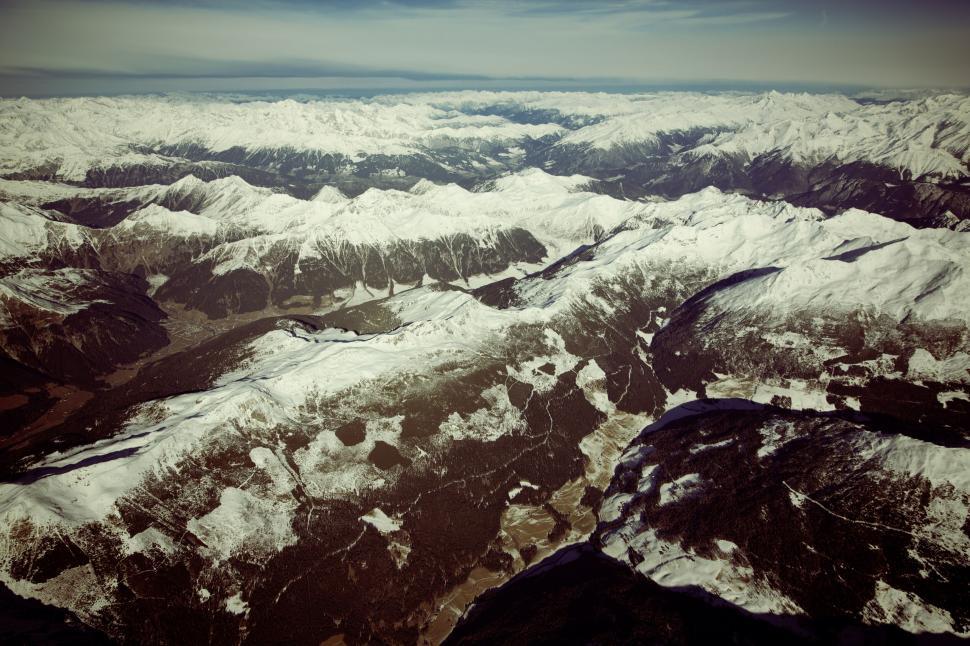 Free Image of Aerial view of snowy mountain ranges 