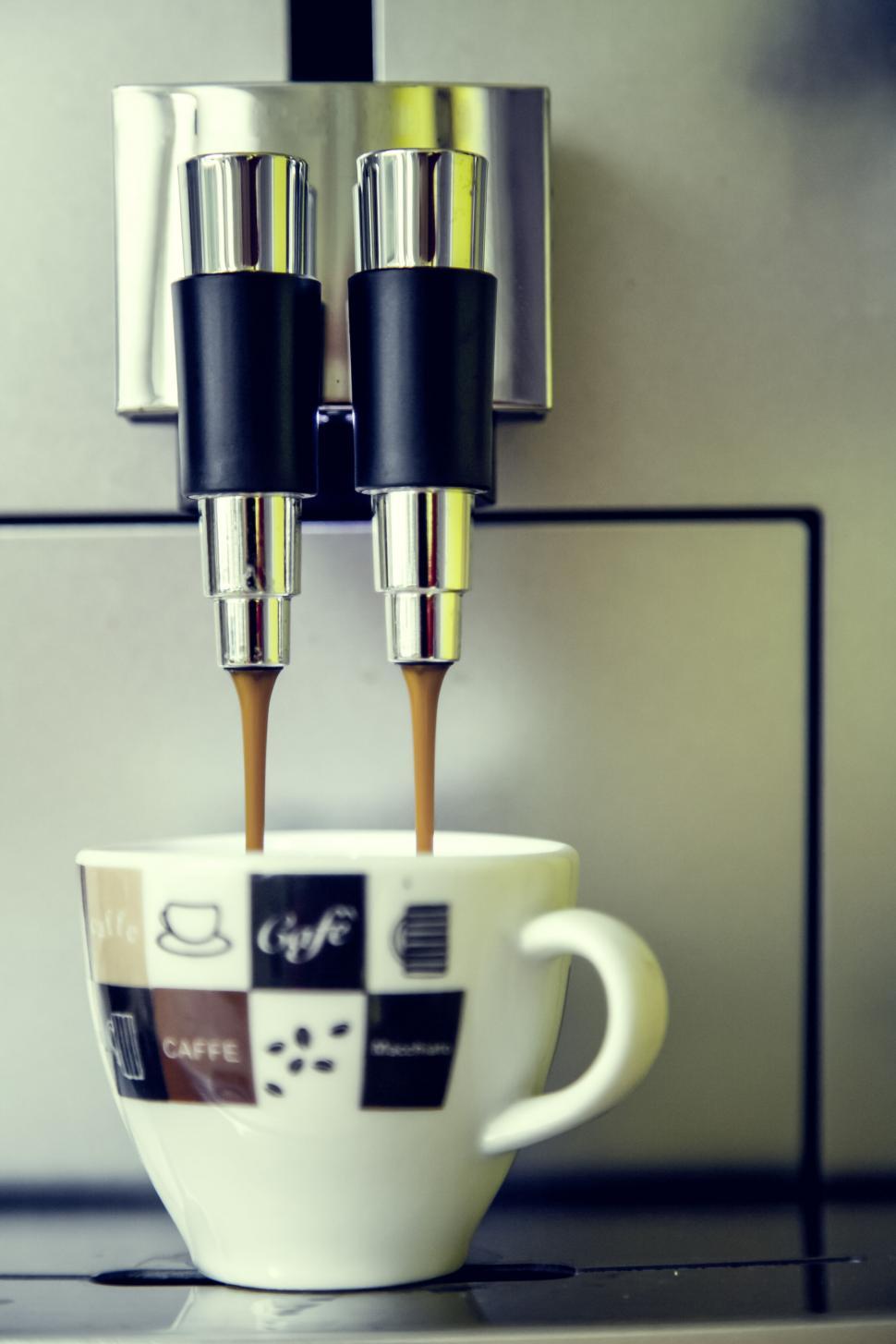 Free Image of Espresso being poured into a cup 