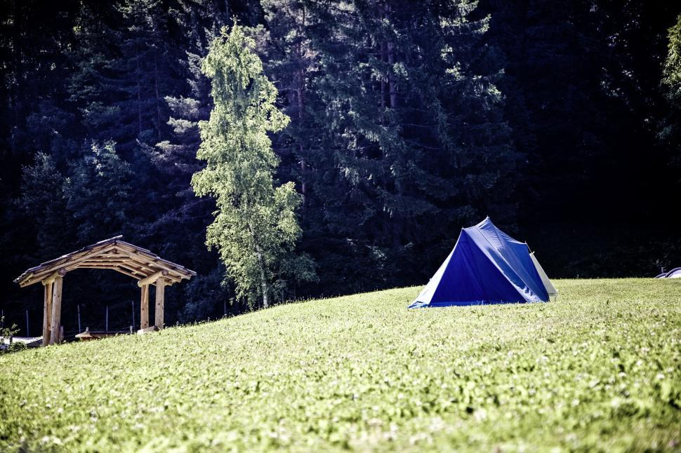 Free Image of Blue camping tent on a lush green field 