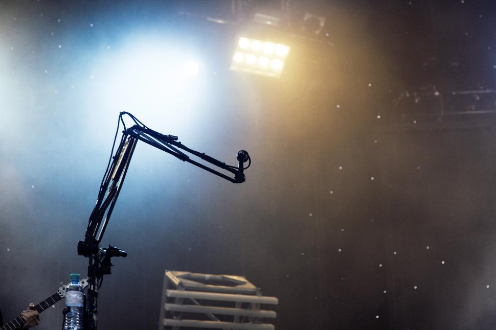 Free Image of Stage microphone under bright spotlight 
