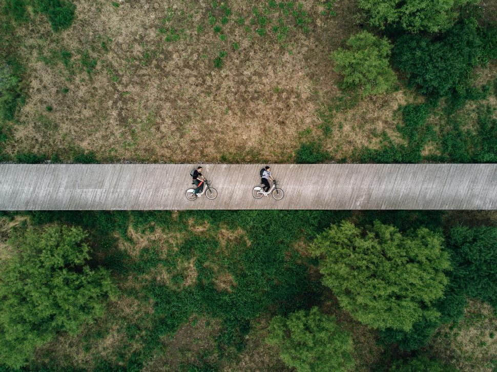 Free Image of Aerial shot of two cyclists on pathway 