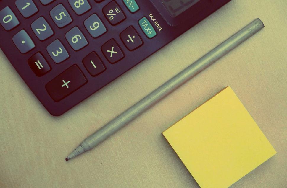 Free Image of Work desk with calculator and writing materials 