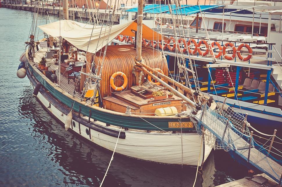 Free Image of Classic sailboat docked at the marina 
