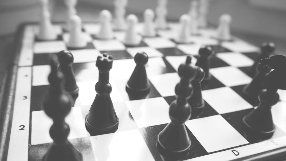 Free Image of Black and white chessboard in mid-game position 