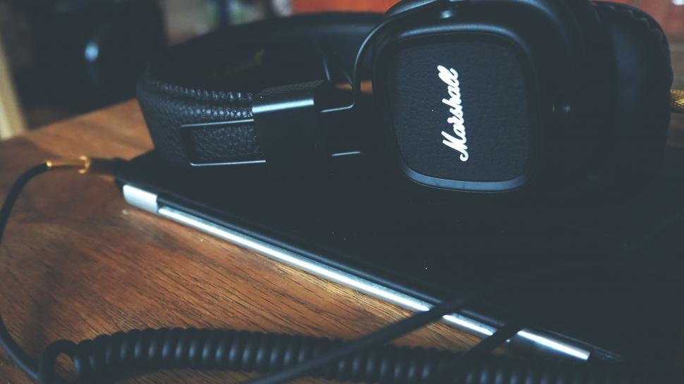 Free Image of Close-up of a Marshall headphone on a wooden surface 