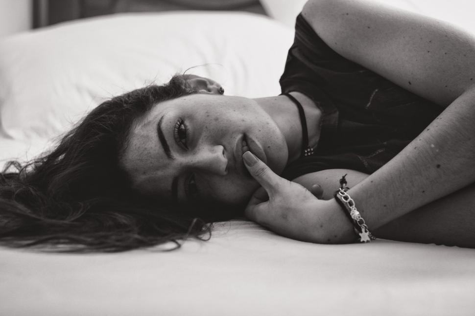 Free Image of Intimate monochrome photo of a contemplative woman 