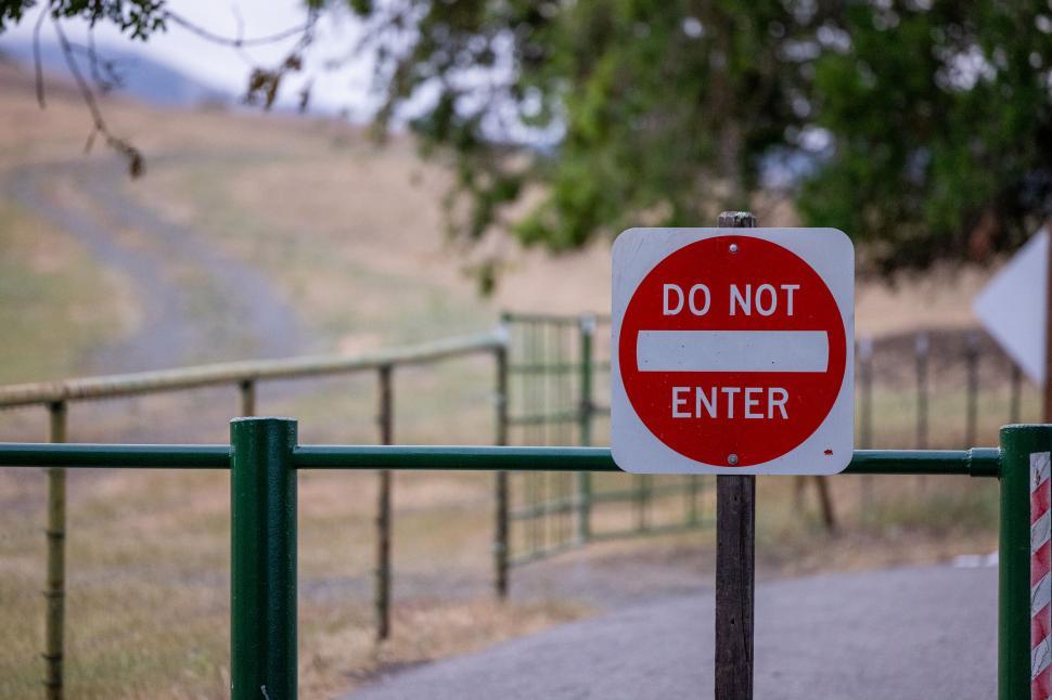 Free Image of Red Do Not Enter sign on green gate 