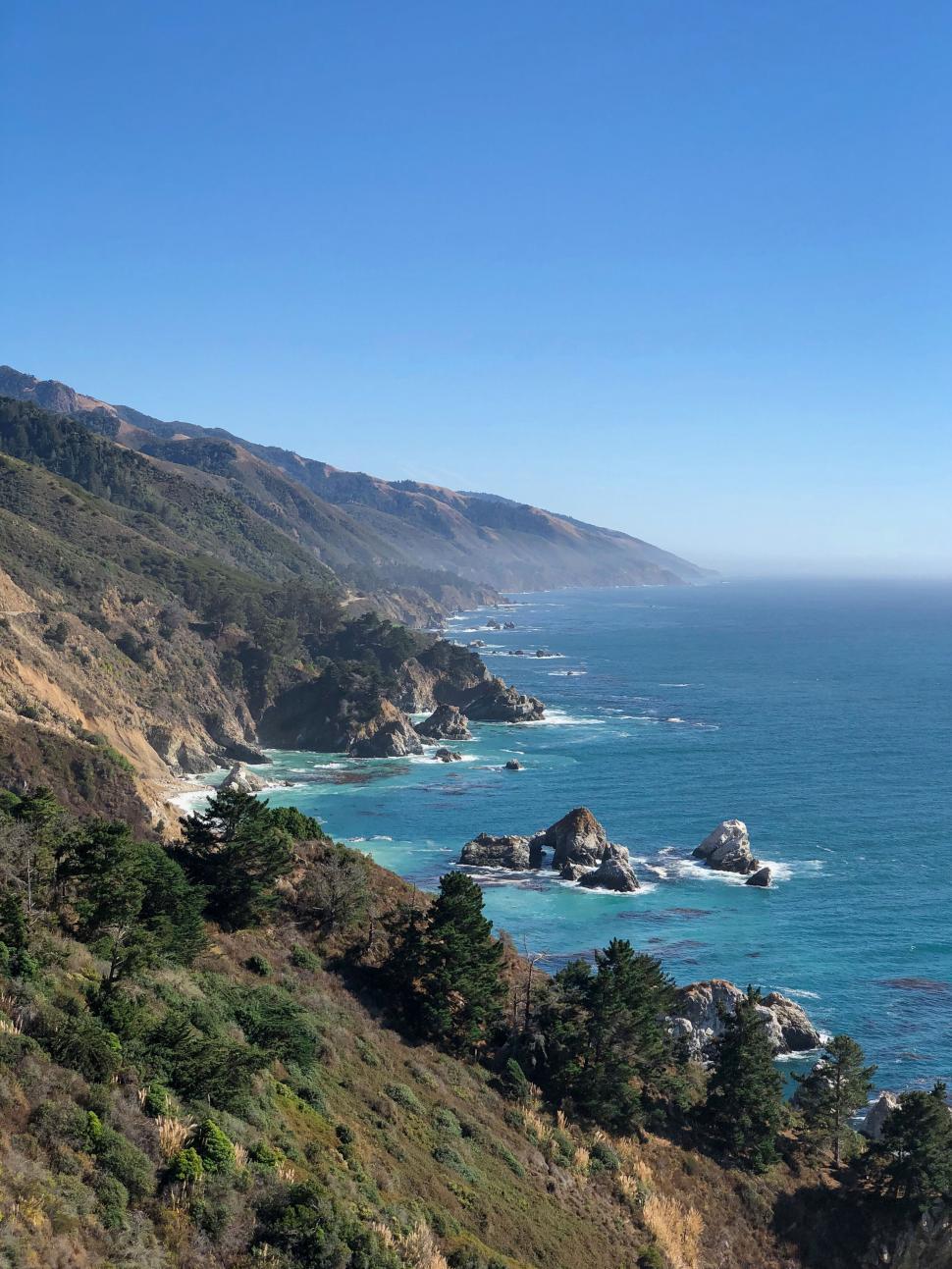 Free Image of Coastal landscape with rocks and blue sea 